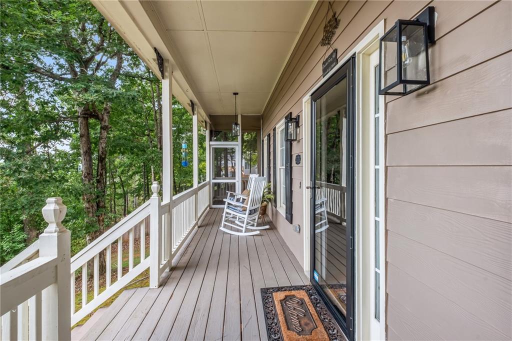 555 Douthit Ferry Road Cartersville, GA 30120 - Photo 4 of 36 a view of balcony with wooden floor and iron fence