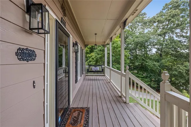 a view of a balcony with wooden floor