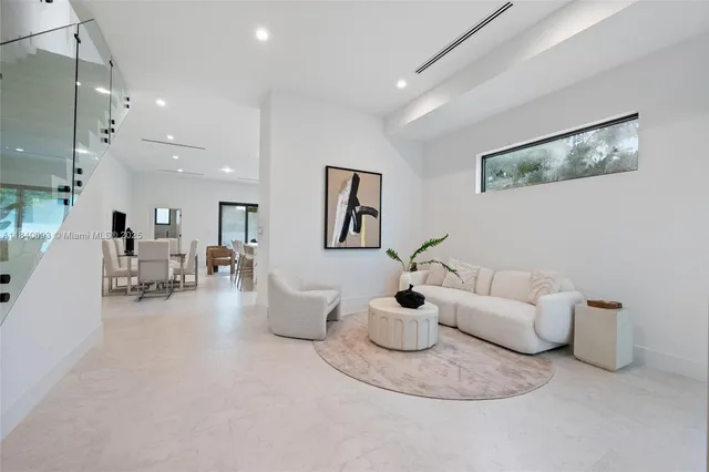 a living room with furniture and a table