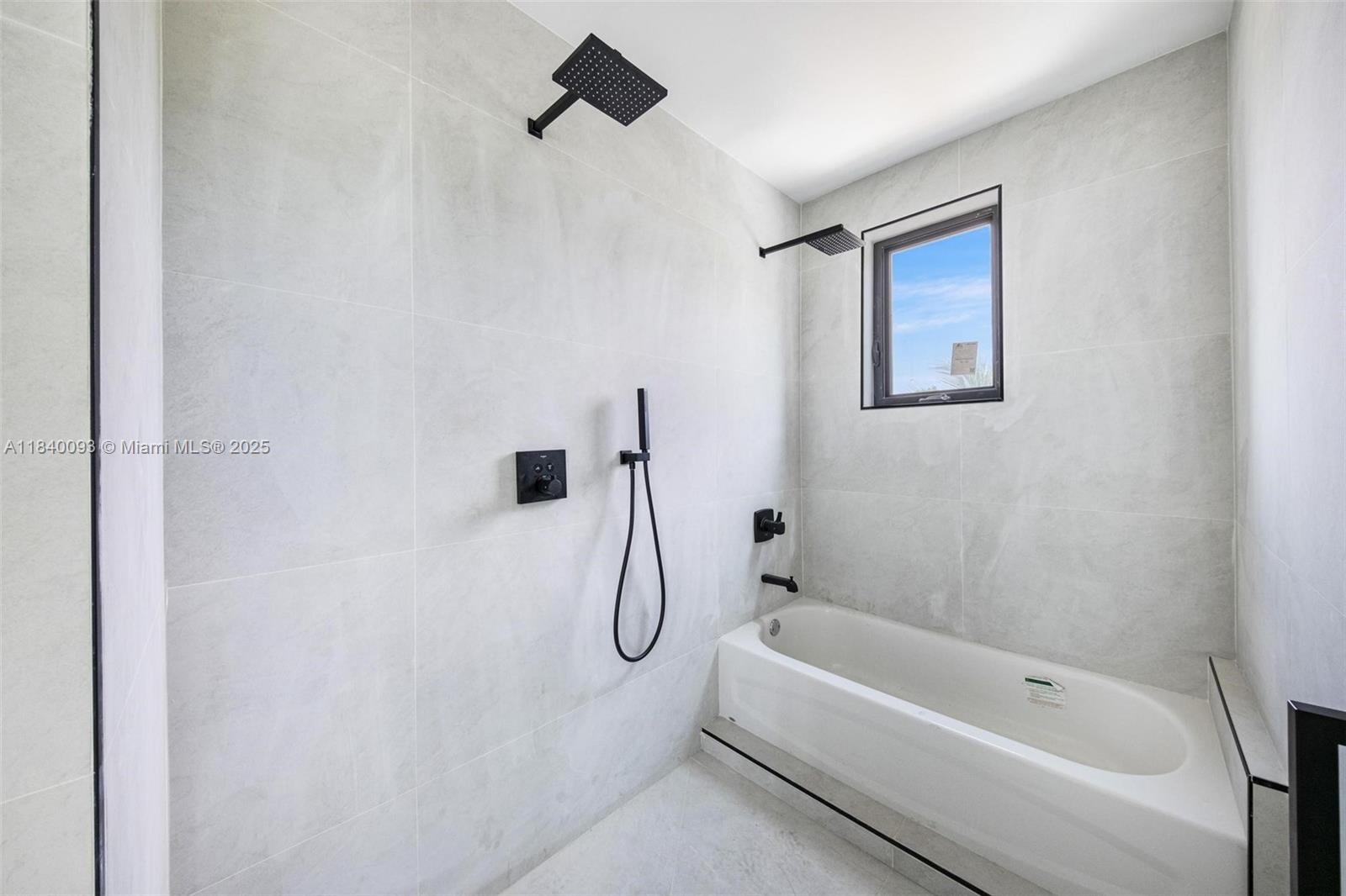2937 Southwest 21st Street Miami, FL 33145 - Photo 15 of 30 a bathroom with a bathtub and a shower