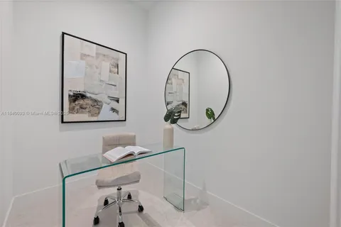 a bathroom with a mirror and a glass door
