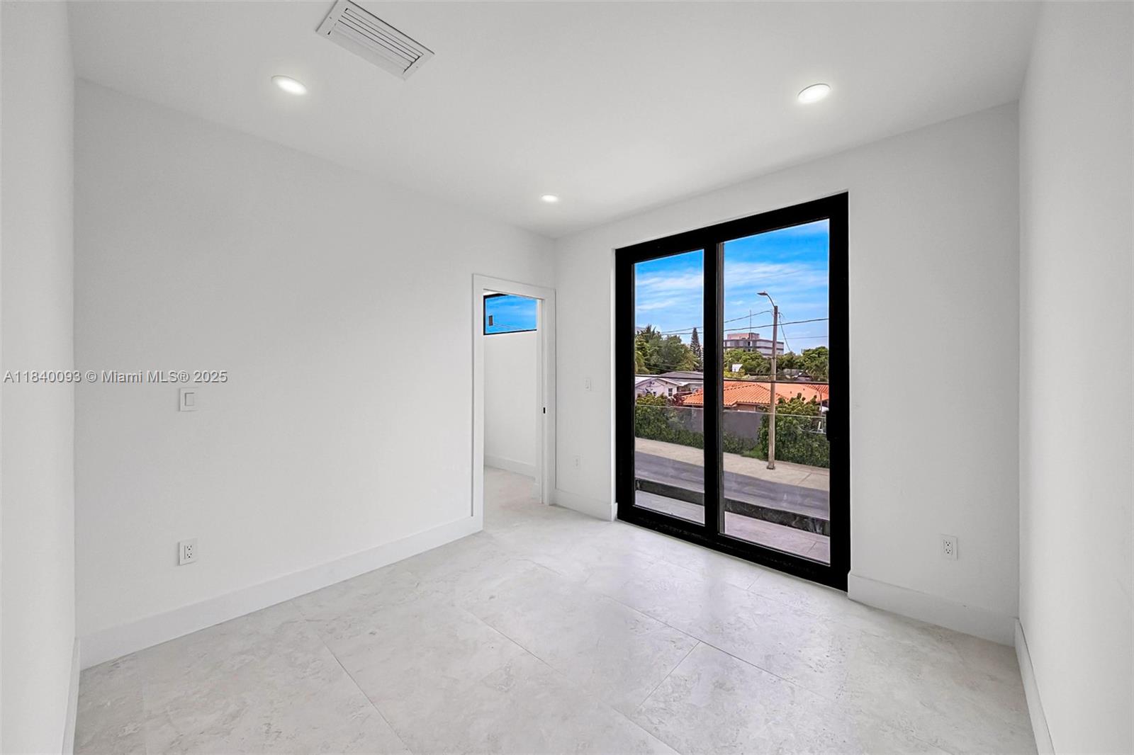 2937 Southwest 21st Street Miami, FL 33145 - Photo 20 of 30 an empty room with sliding glass door and shower