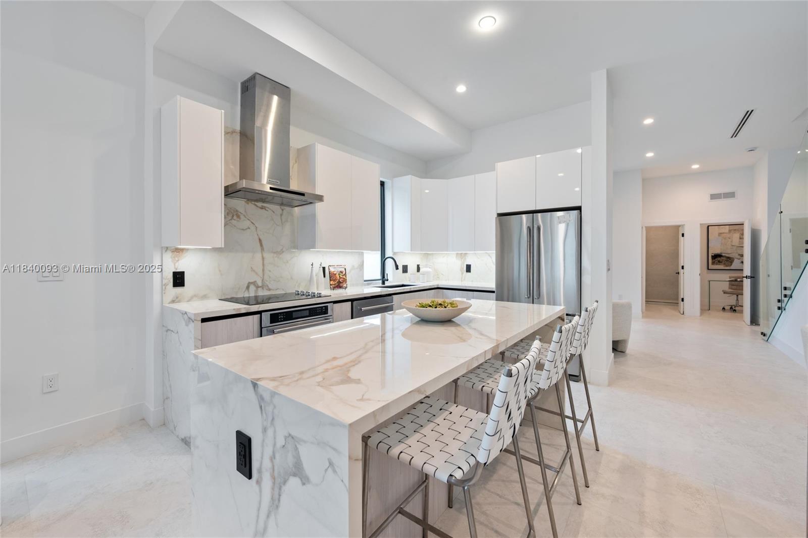 2937 Southwest 21st Street Miami, FL 33145 - Photo 8 of 30 a kitchen with stainless steel appliances a sink and a refrigerator