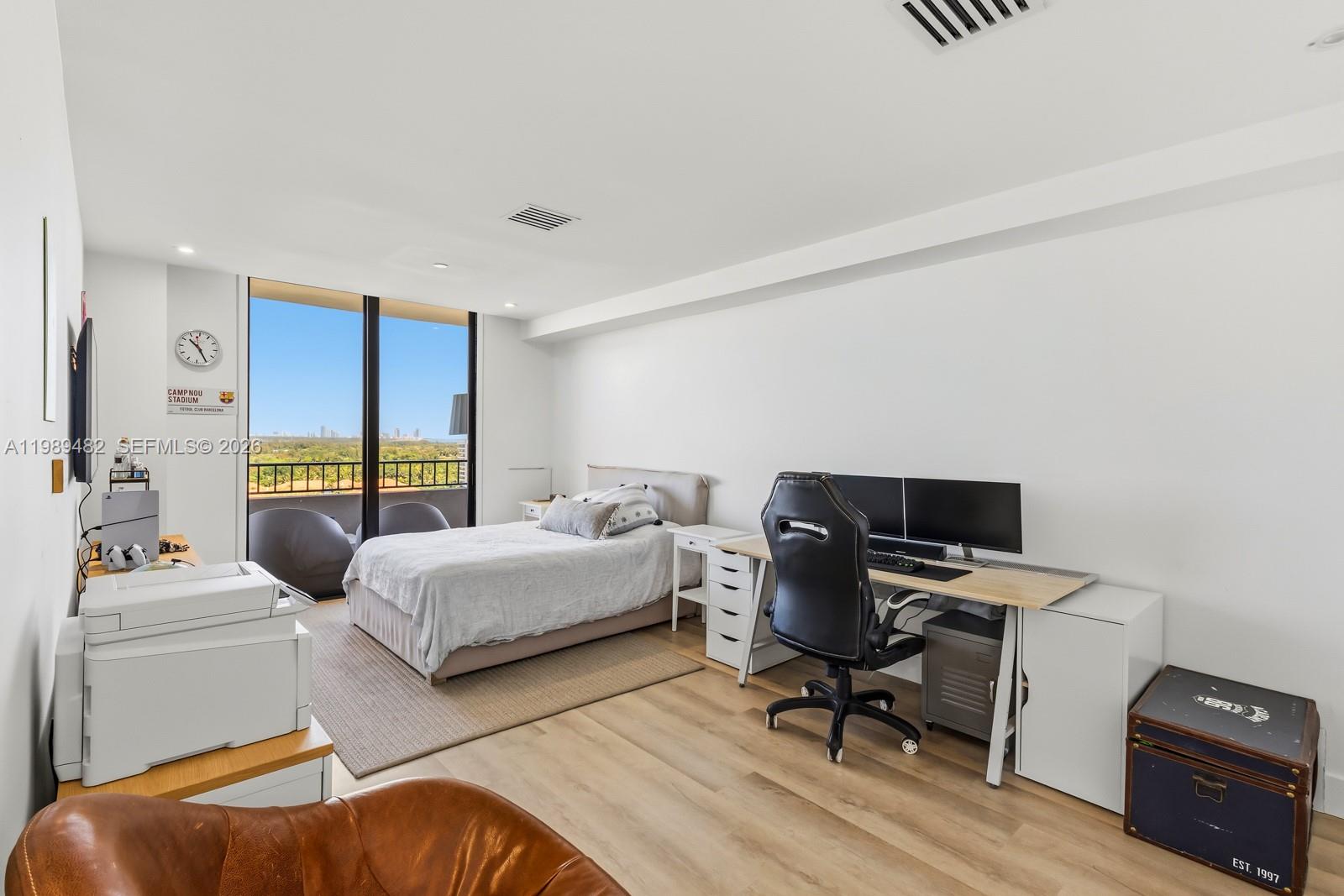 151 Crandon Boulevard, Unit 1222 Key Biscayne, FL 33149 - Photo 17 of 31 a bedroom with furniture and a window