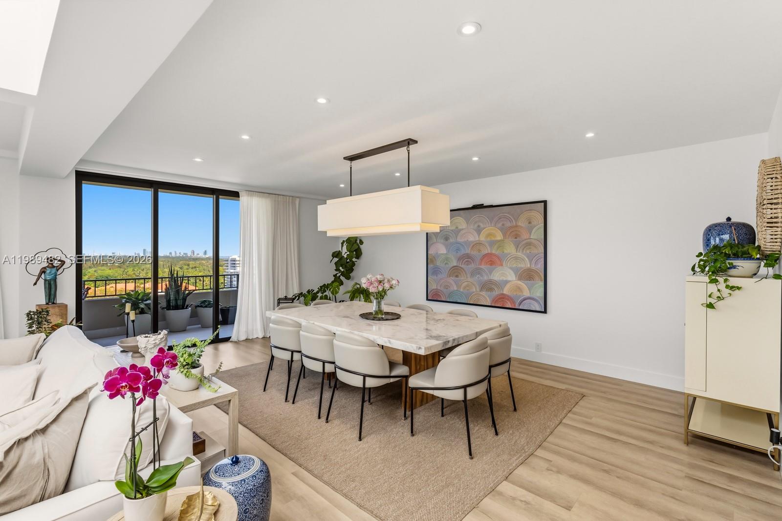151 Crandon Boulevard, Unit 1222 Key Biscayne, FL 33149 - Photo 2 of 31 a view of a dining room with furniture window and wooden floor