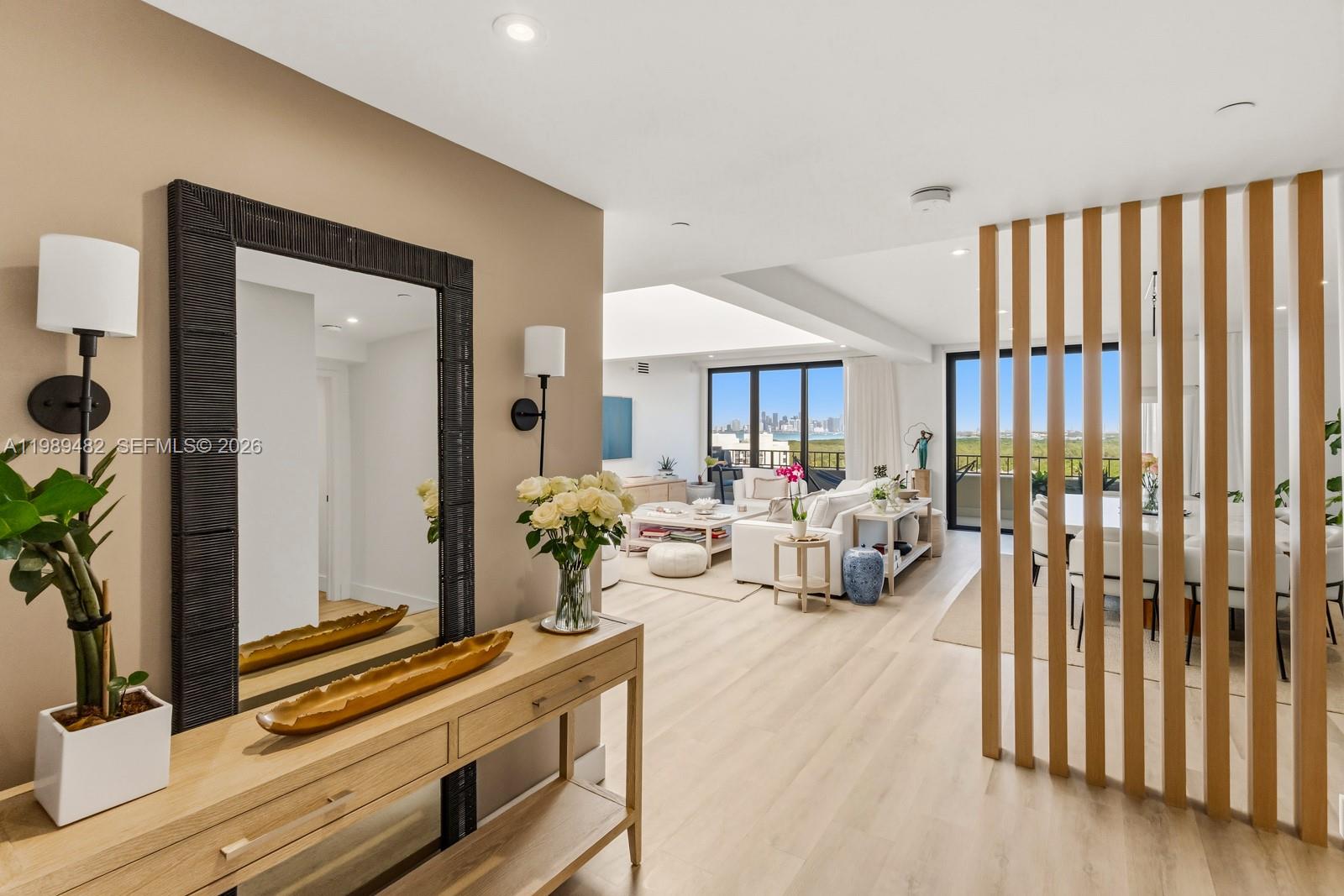 151 Crandon Boulevard, Unit 1222 Key Biscayne, FL 33149 - Photo 5 of 31 a living room with furniture and wooden floor