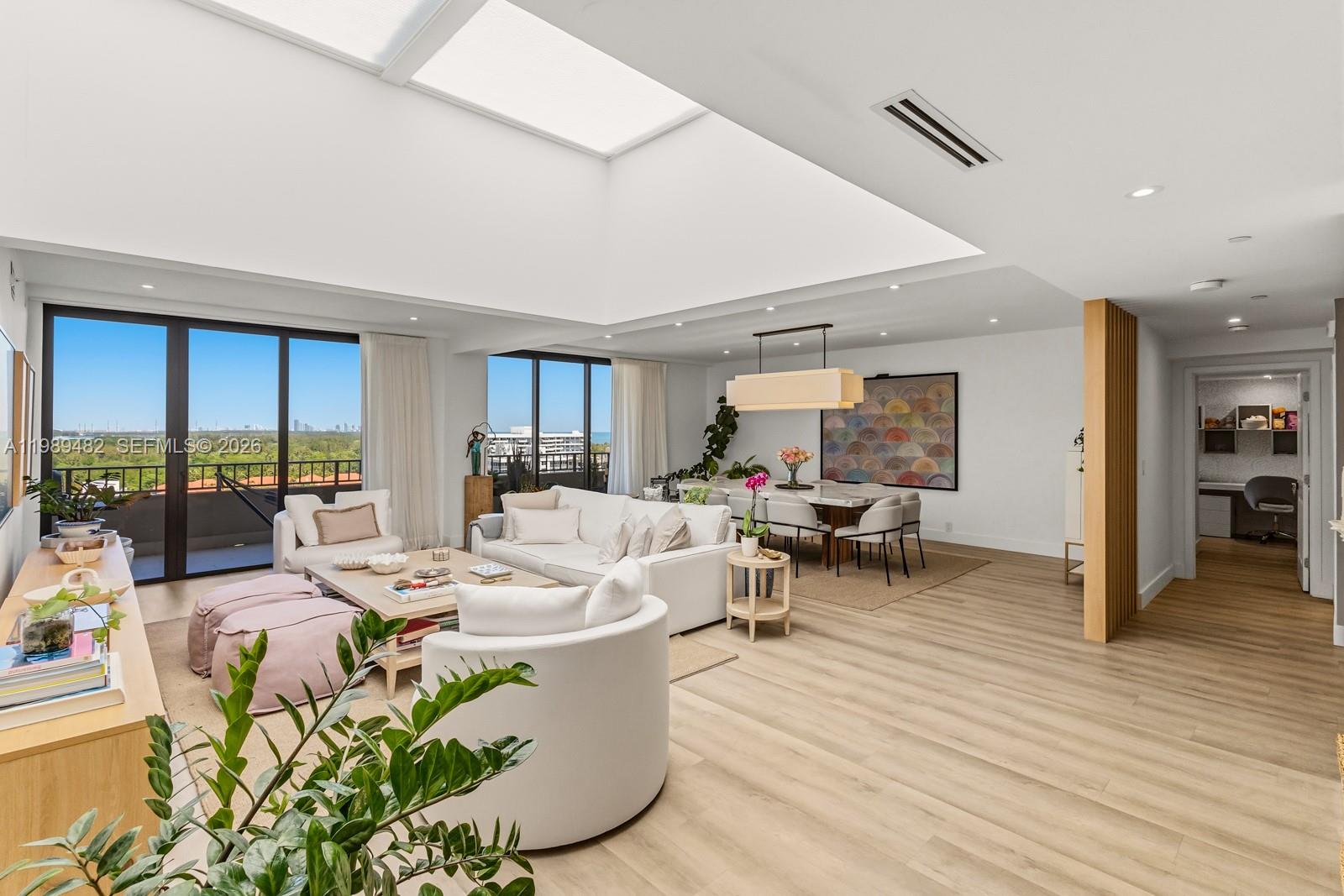 151 Crandon Boulevard, Unit 1222 Key Biscayne, FL 33149 - Photo 7 of 31 a living room with fireplace furniture and a wooden floor