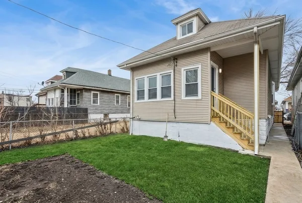 front view of a house with a yard