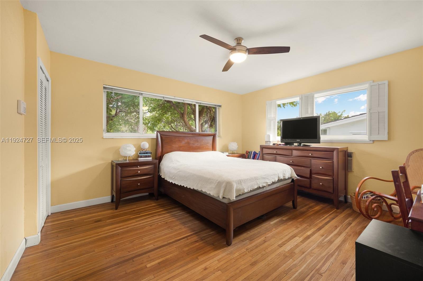 1420 Southwest 82nd Avenue Miami, FL 33144 - Photo 13 of 25 a bed room with a bed and a flat tv screen