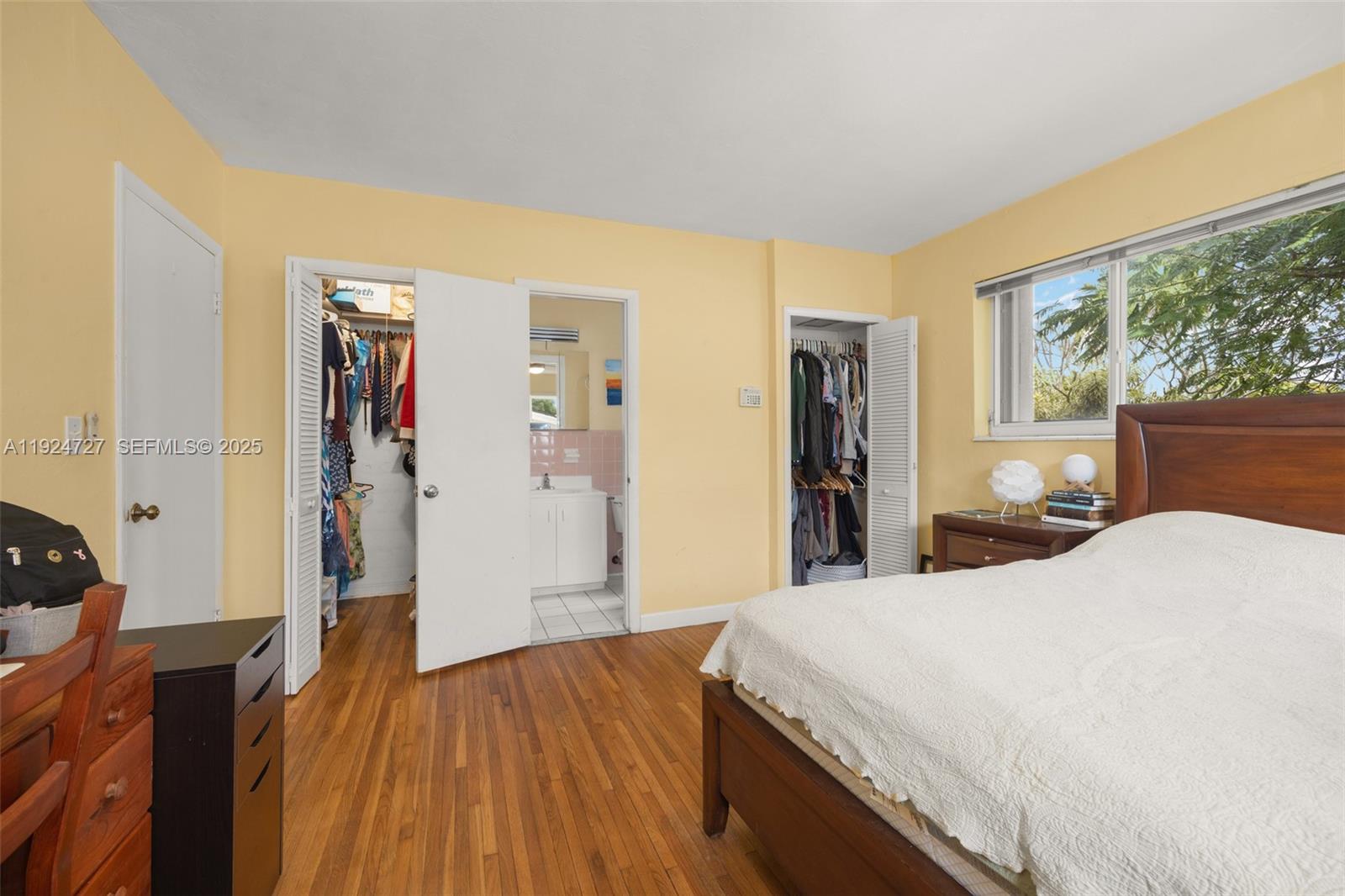 1420 Southwest 82nd Avenue Miami, FL 33144 - Photo 14 of 25 a room with a bed and wooden floor