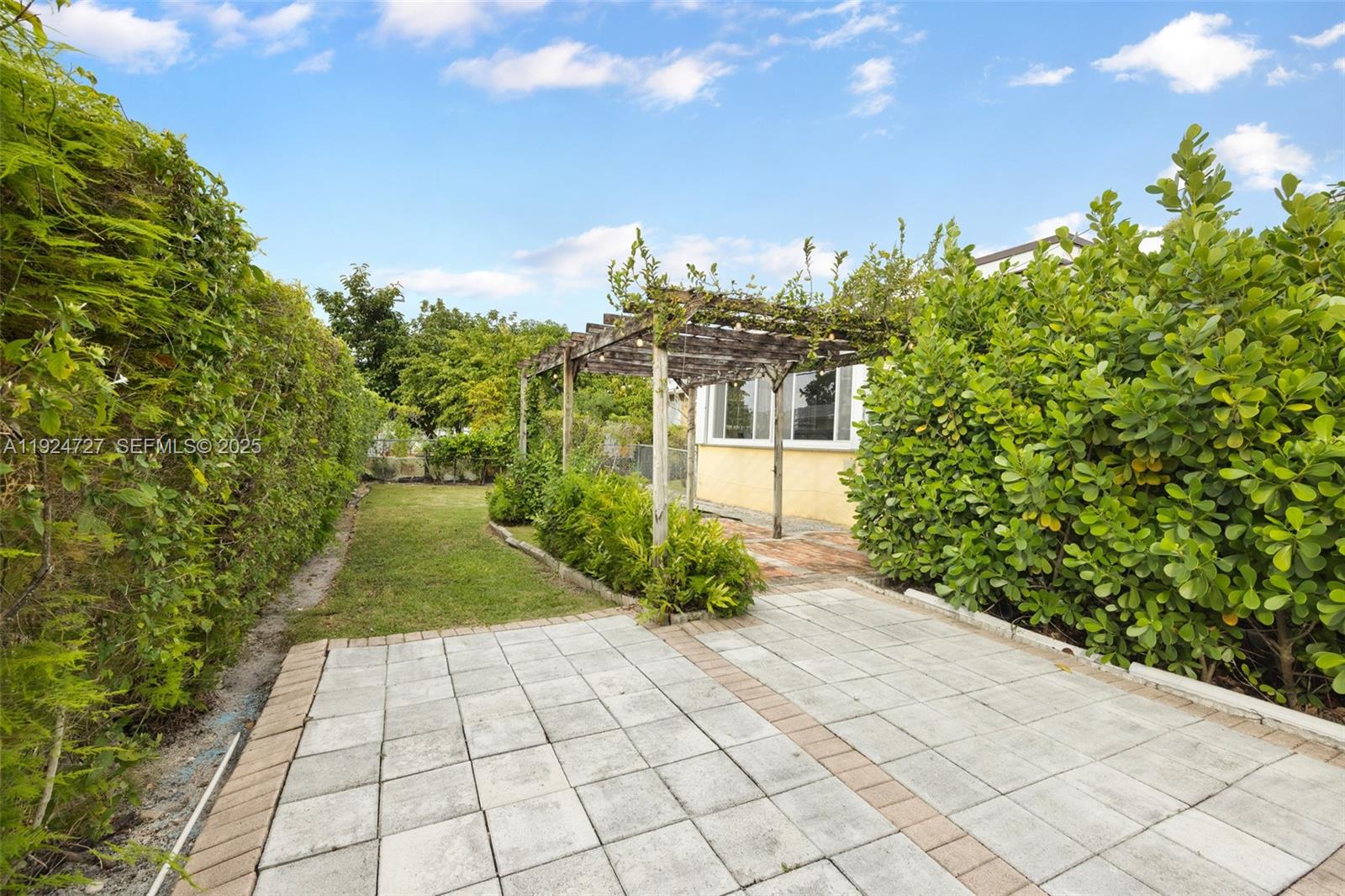 1420 Southwest 82nd Avenue Miami, FL 33144 - Photo 22 of 25 a view of a pathway both side of building