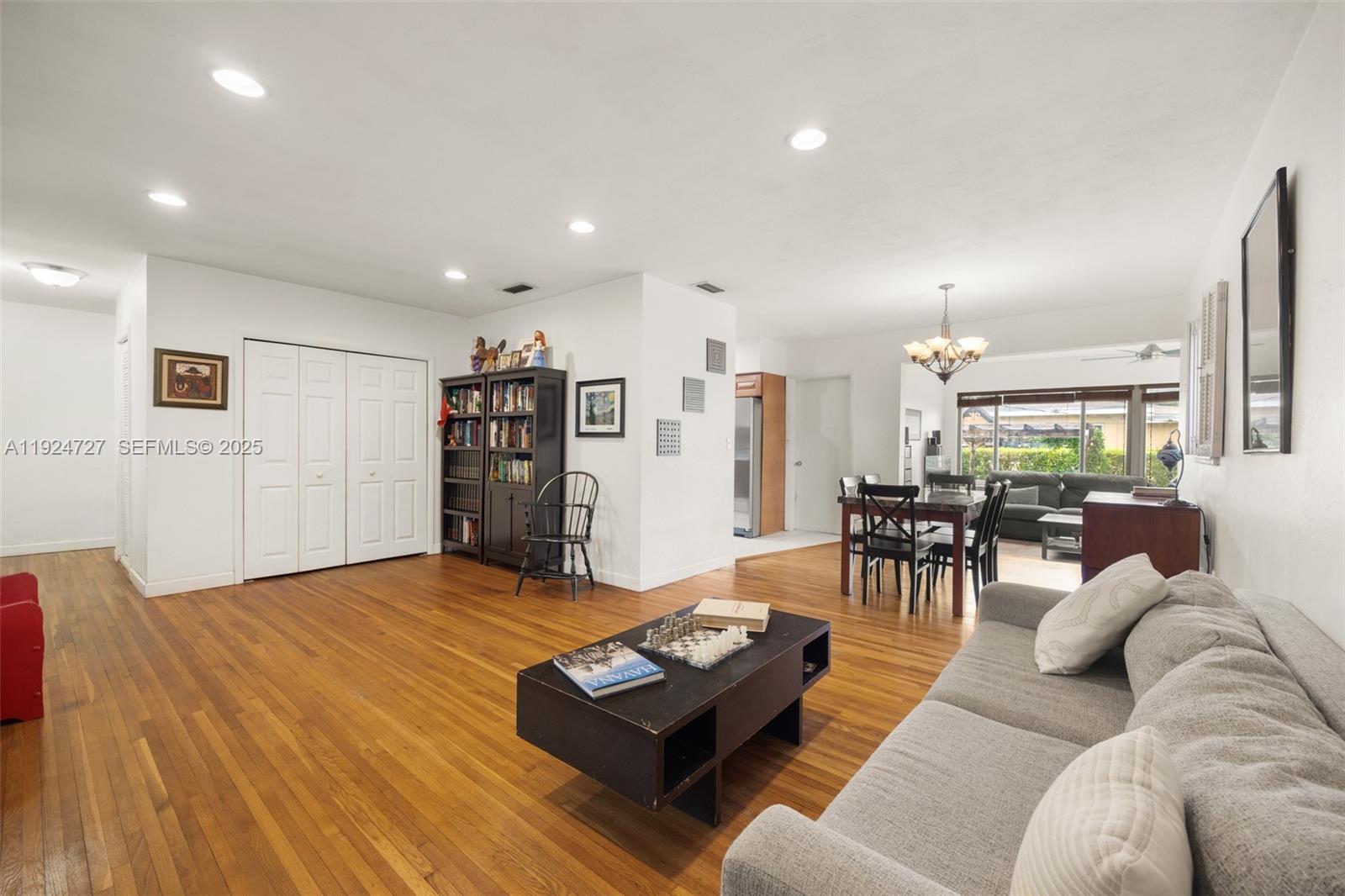 1420 Southwest 82nd Avenue Miami, FL 33144 - Photo 5 of 25 a living room with furniture and wooden floor