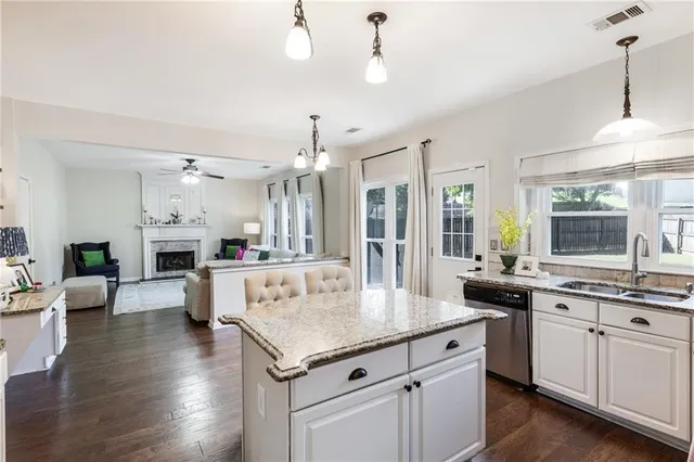 a very nice looking room with a large window and wooden floor