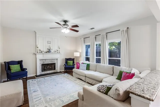 a room with a bed and a large window with wooden floor