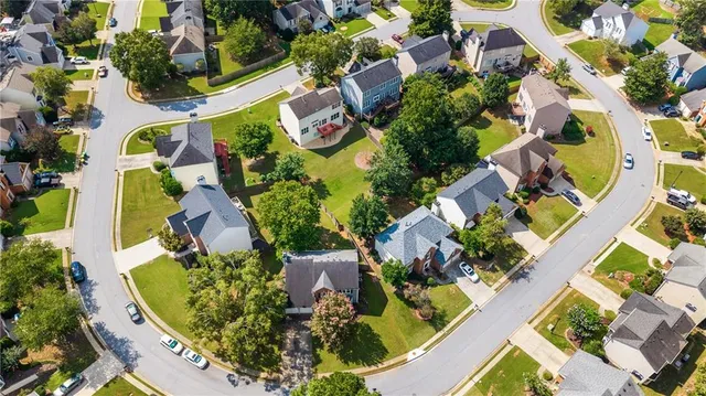an aerial view of residential house with outdoor space and swimming pool