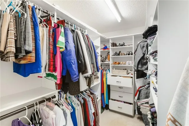 a room with a couch and chandelier
