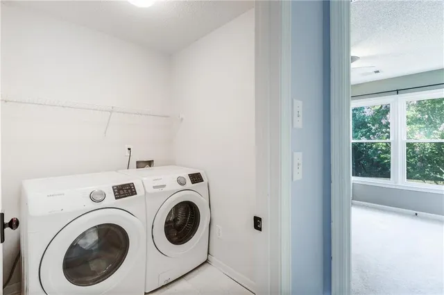 a view of a house with swimming pool next to a yard