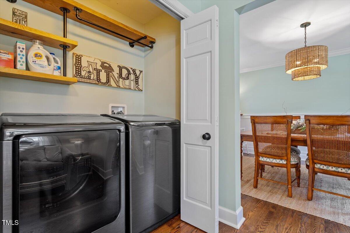134 Landsbury Drive Durham, NC 27707 - Photo 11 of 44 a view of a hallway with wooden floor and furniture