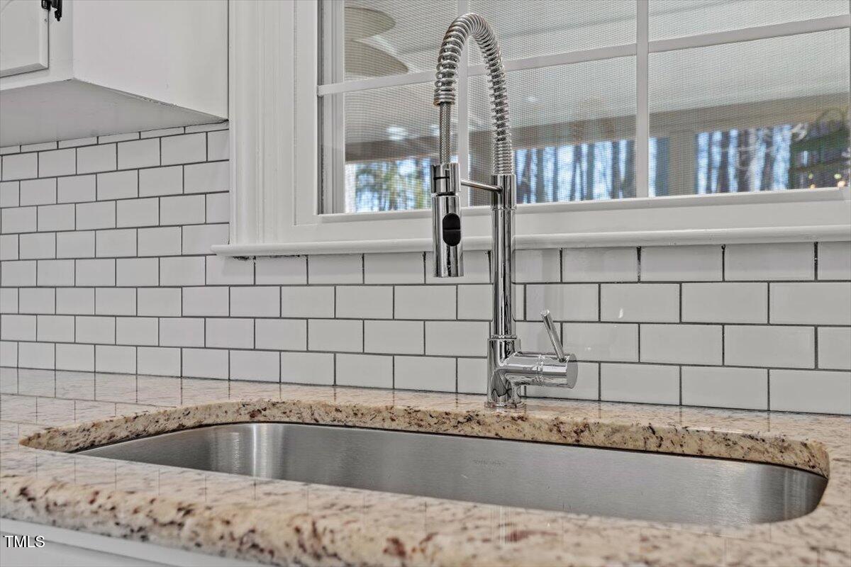 134 Landsbury Drive Durham, NC 27707 - Photo 20 of 44 a view of a kitchen with a sink and cabinets