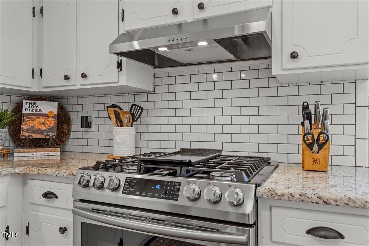 134 Landsbury Drive Durham, NC 27707 - Photo 21 of 44 a stove top oven sitting inside of a kitchen