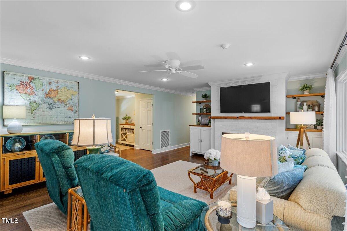 134 Landsbury Drive Durham, NC 27707 - Photo 22 of 44 a living room with furniture and a flat screen tv