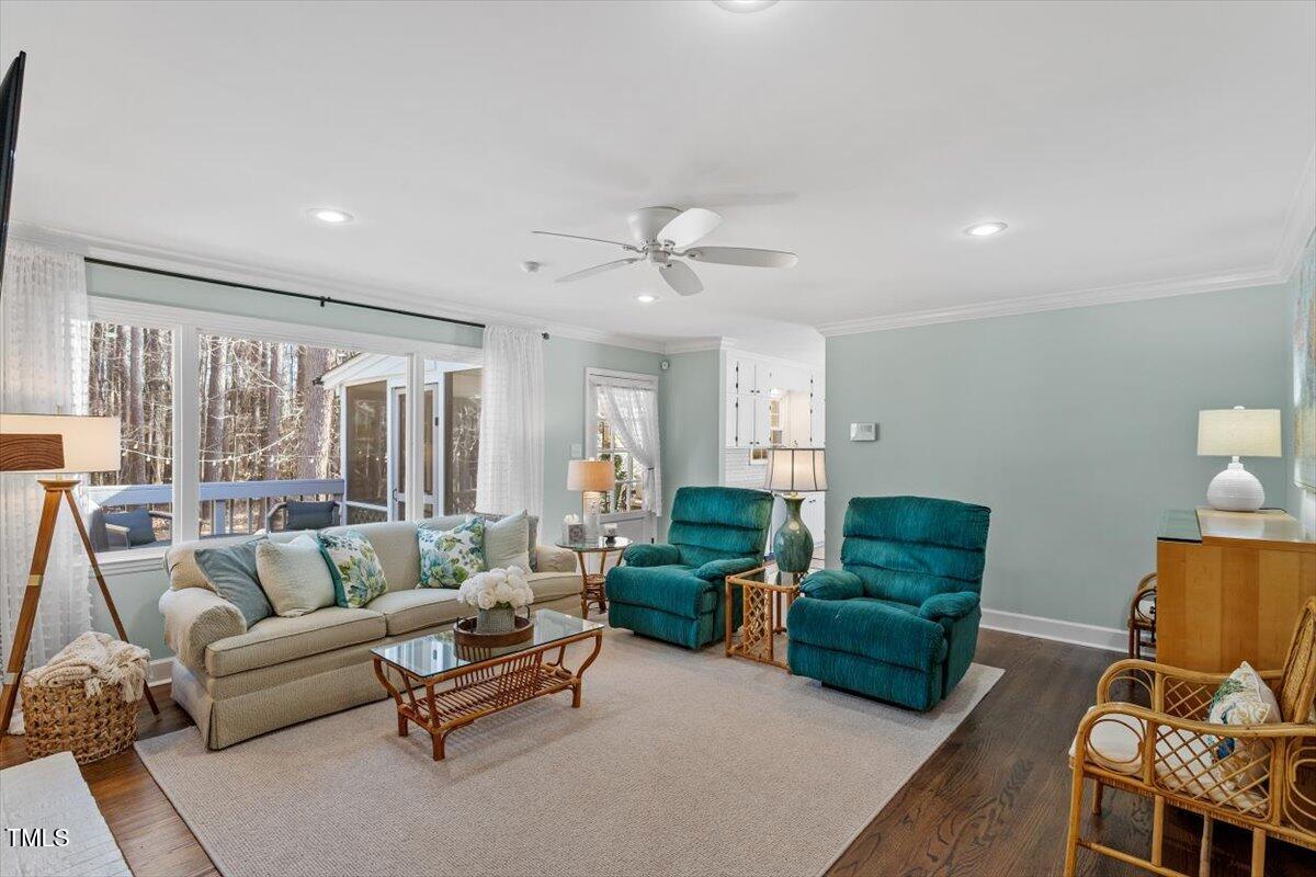 134 Landsbury Drive Durham, NC 27707 - Photo 24 of 44 a living room with furniture rug and a large window