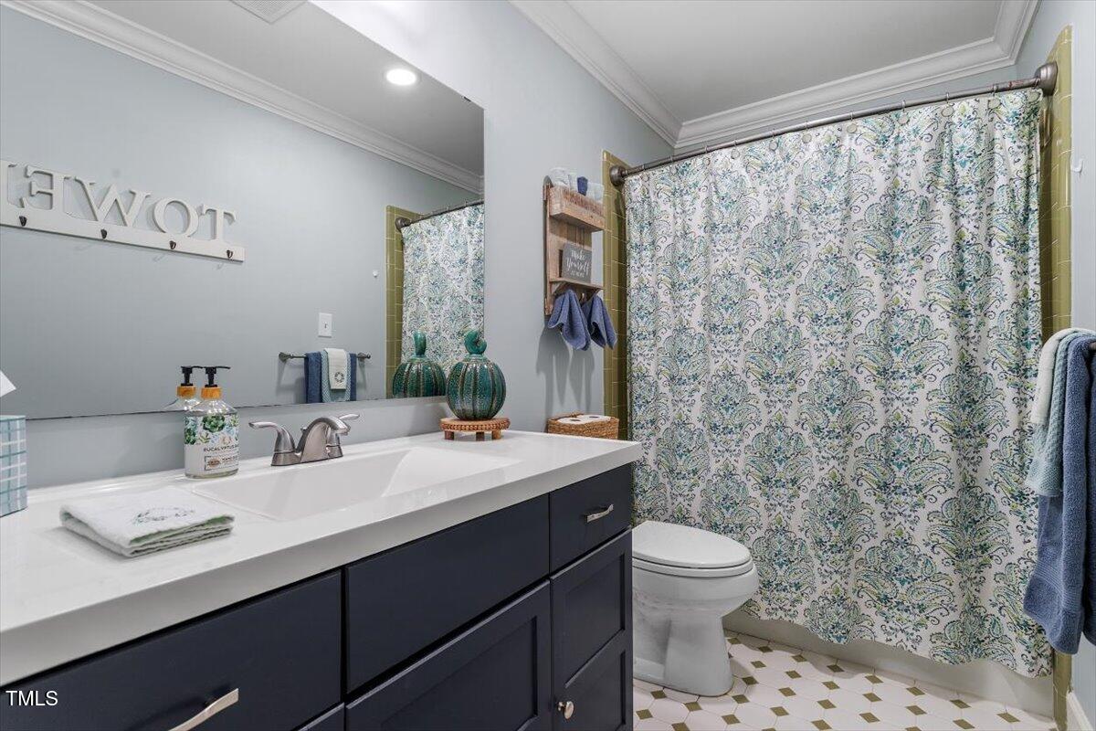 134 Landsbury Drive Durham, NC 27707 - Photo 27 of 44 a bathroom with a sink toilet and shower