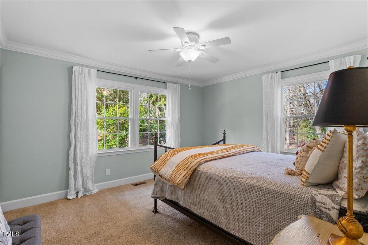 134 Landsbury Drive Durham, NC 27707 - Photo 31 of 44 a bedroom with a bed and window