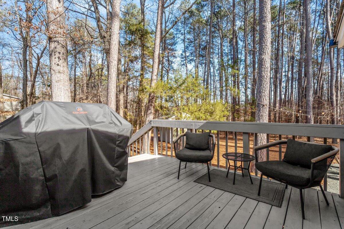 134 Landsbury Drive Durham, NC 27707 - Photo 38 of 44 a roof deck with a table and chairs