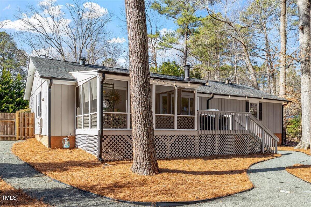 134 Landsbury Drive Durham, NC 27707 - Photo 39 of 44 a view of a house with a small yard and large tree