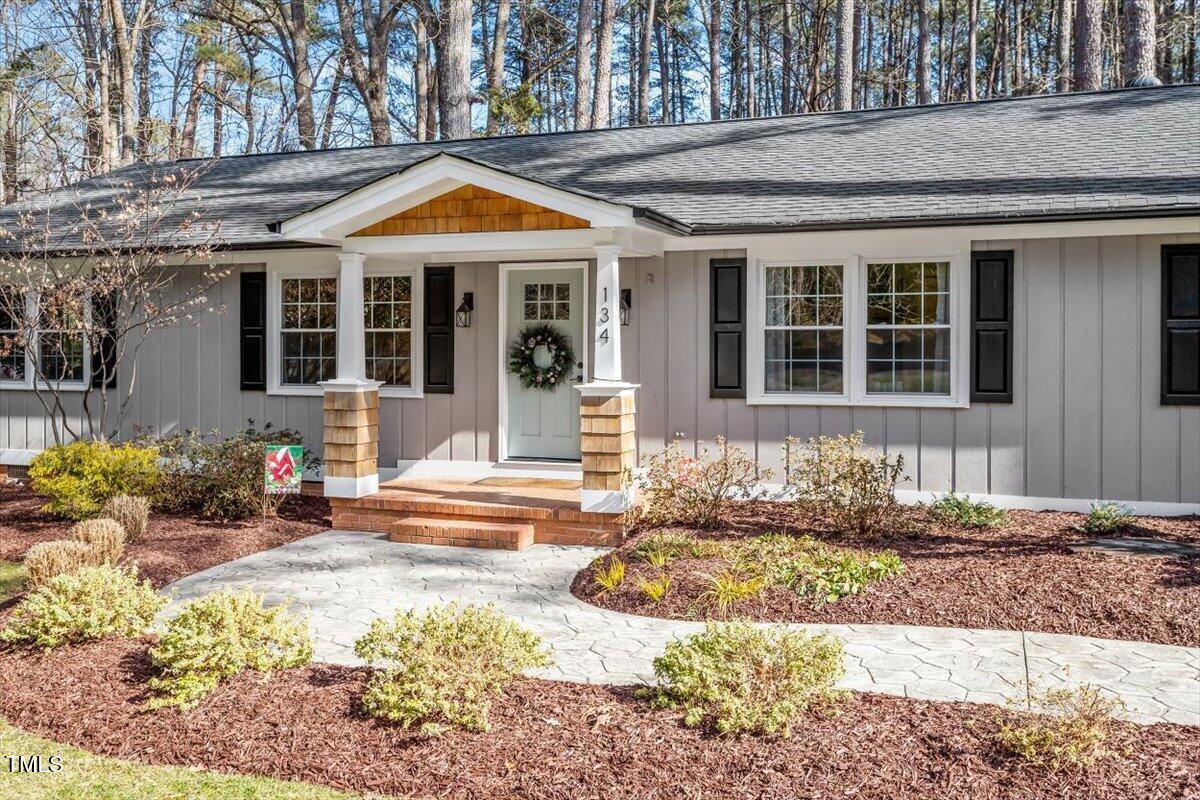 134 Landsbury Drive Durham, NC 27707 - Photo 5 of 44 a front view of a house with a yard