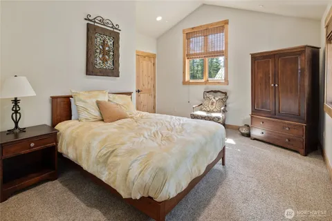 a bedroom with bed and window