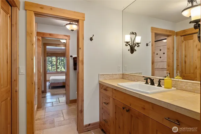 a bathroom with a sink and a mirror