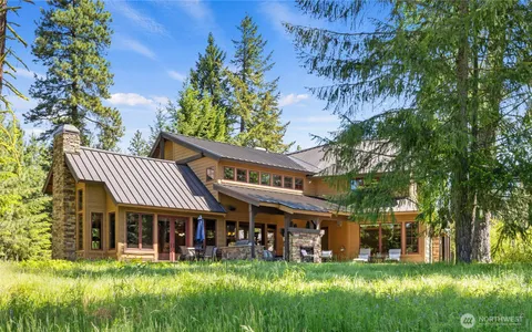 a view of a house with a yard porch and sitting area