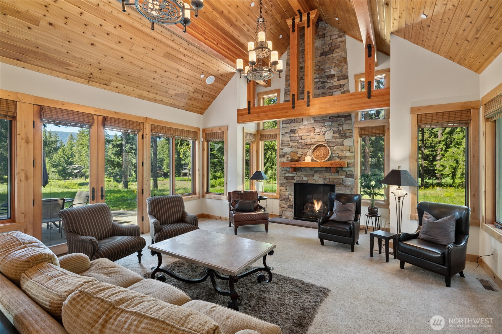 1531 Larkspur Loop Cle Elum, WA 98922 - Photo 8 of 36 a living room with furniture a fireplace and a large window