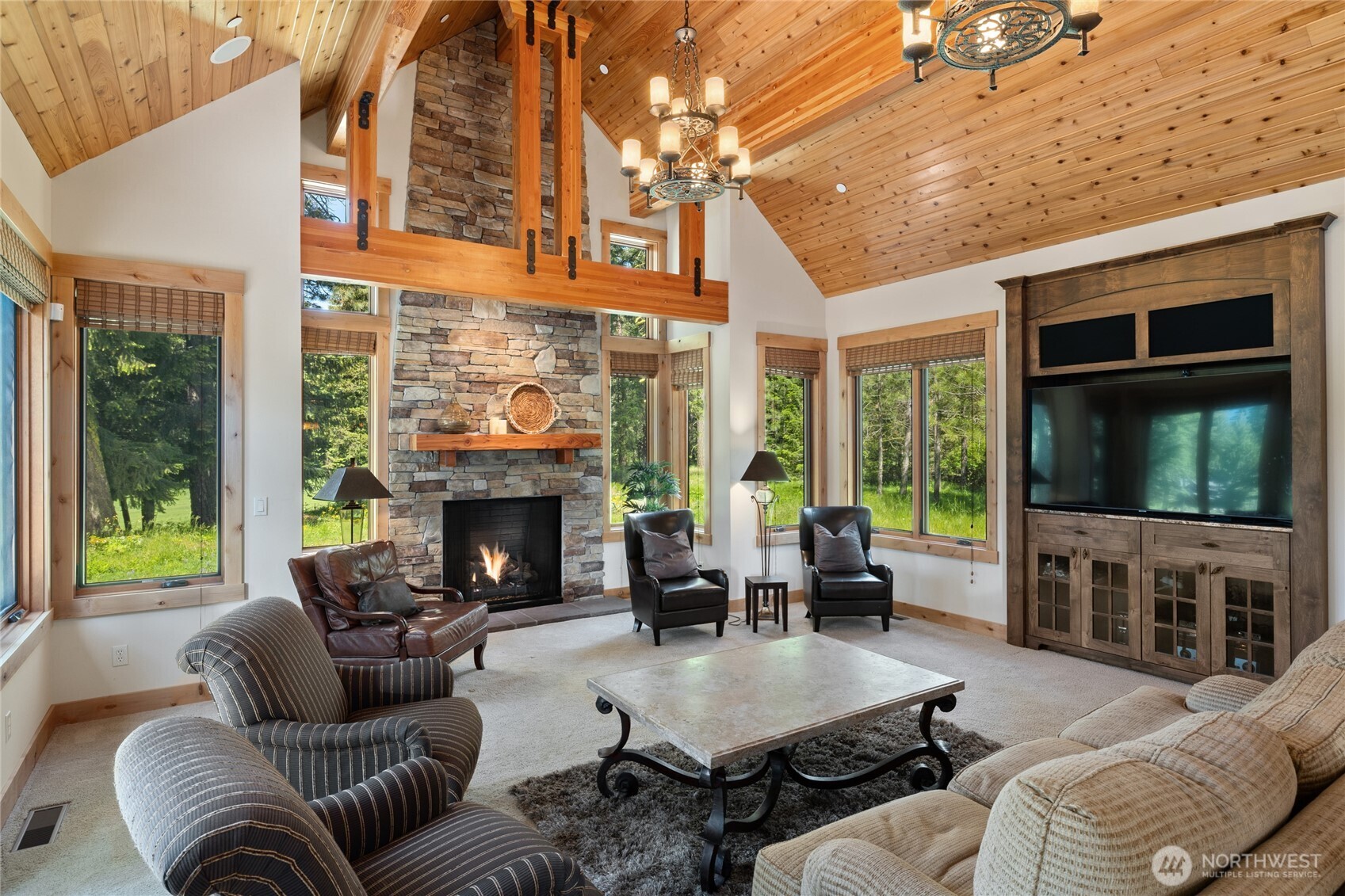 1531 Larkspur Loop Cle Elum, WA 98922 - Photo 10 of 36 a living room with furniture a fireplace and a large window