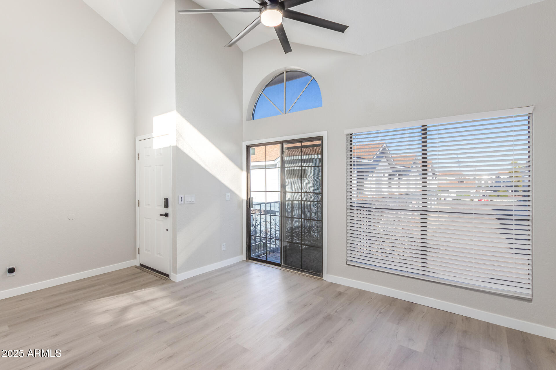 8888 North 47th Avenue, Unit 212 Glendale, AZ 85302 - Photo 5 of 18 wooden floor in an empty room with a window
