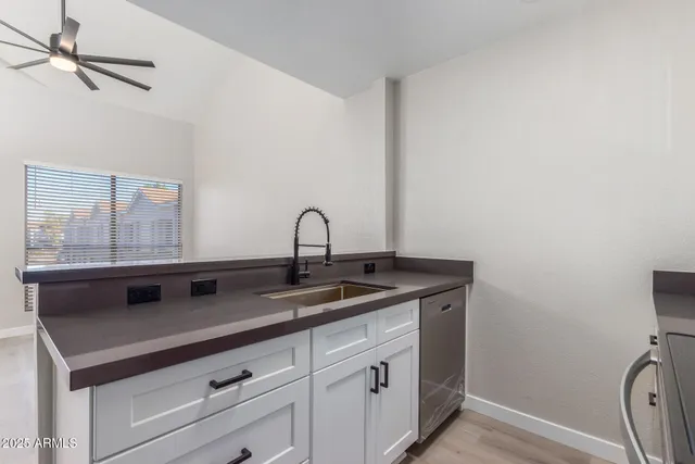 a kitchen with a sink and a window