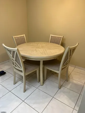 a bedroom with a bed tv and a window