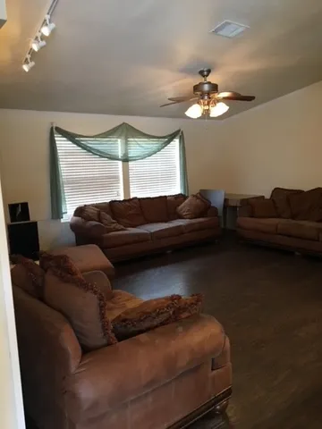 a living room with furniture and a window