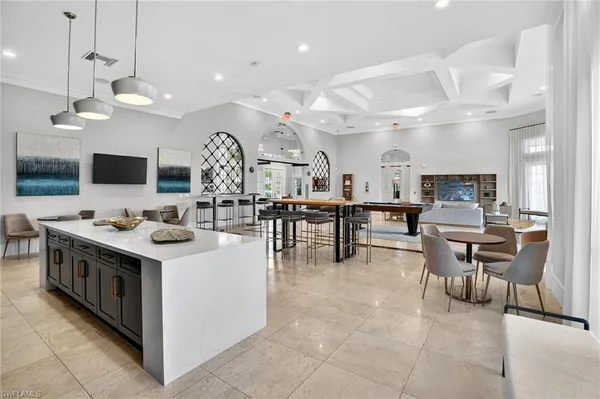 a view of a swimming pool with outdoor seating