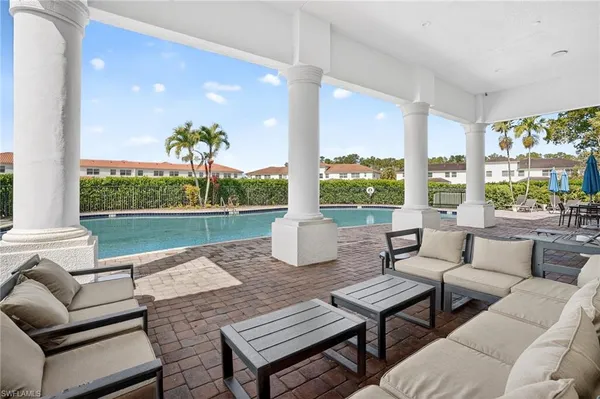 a view of a patio with couches chairs and a table
