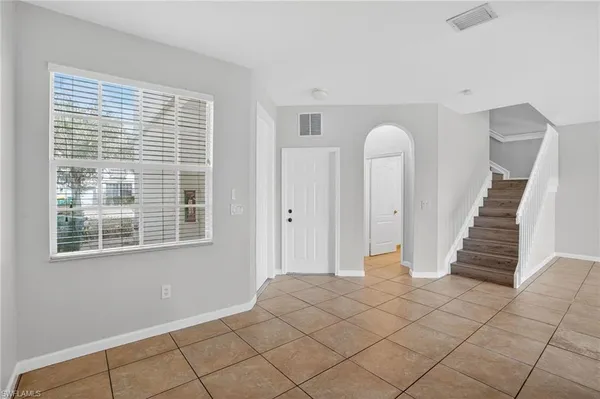 a view of entryway with stairs and wooden floor