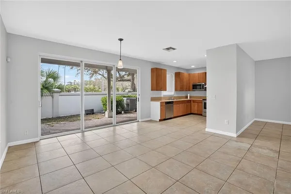 a view of a kitchen with furniture and large windows
