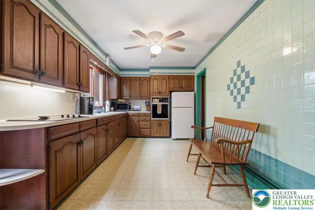 a kitchen with stainless steel appliances kitchen island granite countertop a sink and cabinets