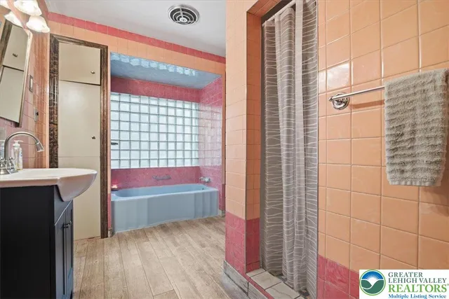 a bathroom with a sink and a shower