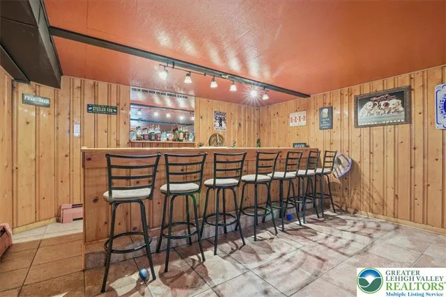 a dining room with furniture and a chandelier