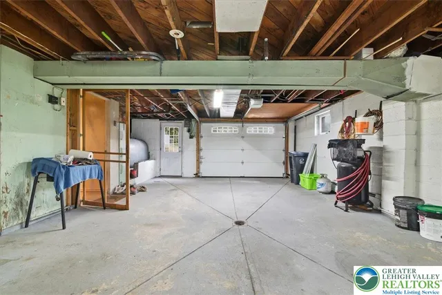 a view of house with outdoor space and sitting area