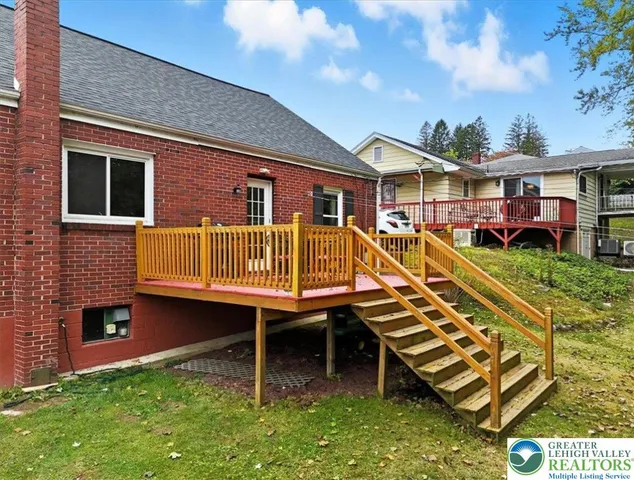 a view of a chairs and table in the patio