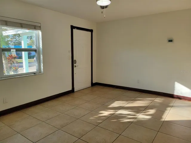 a view of an empty room with a window